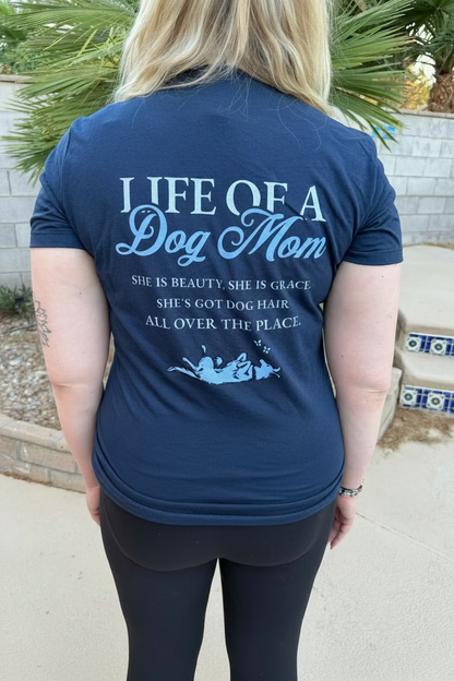 Person wearing a navy blue t-shirt with a quote about dog moms.